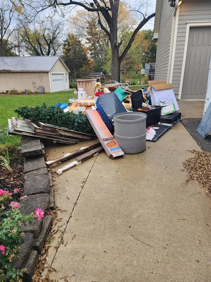 Dumpster being loaded with debris for Demolition Dumpster Rental in Archbold
